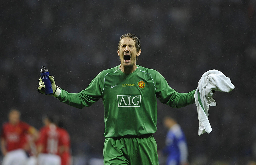 The Ajax squad wearing a goalkeeper jersey with Edwin van der Sar's name on  it. To show their support to the former Ajax goalkeeper and CEO who  suffered a stroke and is