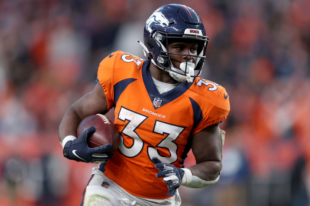 Denver Broncos running back Javonte Williams (33) runs against the