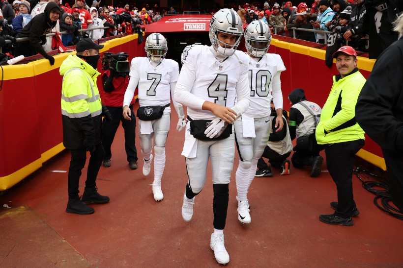 Aidan O'Connell #4, Jimmy Garoppolo #10, and Brian Hoyer #7 walk out prior to a game against the Kansas City Chiefs at GEHA Field at Arrowhead Stadium on December 25, 2023 in Kansas City, Missouri