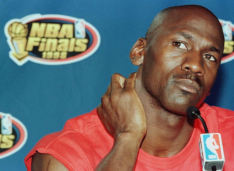 Michael Jordan of the Chicago Bulls listens to a question