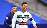 Kylian Mbappe and Cristiano Ronaldo - TOPSHOT-FBL-EUR-NATIONS-FRA-POR